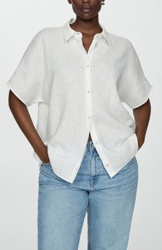 Stay cool throughout the warmer seasons in this lightweight linen button-up perfected by short sleeves and a modern boxy fit. Front button closure Point collar Short sleeves 100% linen Machine wash, line dry Imported Effortless Spread Collar Top For Summer, Classic Linen Shirt For Day Out, Modern Linen Blouse With Relaxed Fit, Vacation Linen Short Sleeve Shirt With Button Closure, Linen Short Sleeve Shirt With Button Closure For Vacation, Summer Linen Button-up Shirt, Summer Linen Shirt With Collar, Modern Linen Shirt For Summer, Modern Linen Summer Shirt