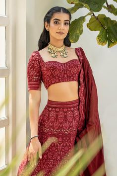 Maroon attached cancan lehenga with floral patterns chikankari embroidery and sequin highlights. Comes with embroidered blouse and dupatta.
Components: 3
Pattern: Embroidered
Type Of Work: Chikankari
Neckline: Sweetheart
Sleeve Type: Short
Fabric: Georgette
Color: Maroon
Other Details: 
Back tie-up blouse
Scalloped embroidered border dupatta
Lehenga length: 45 inches
Occasion: Wedding - Aza Fashions Navratri Fitted Palazzo Set With Intricate Embroidery, Navratri Intricate Embroidered Fitted Palazzo Set, Fitted Palazzo Set With Intricate Embroidery For Navratri, Navratri Intricate Embroidery Fitted Palazzo Set, Bollywood Style Floor-length Sets With Motifs, Bollywood Floor-length Sets With Motifs, Festive Fitted Motifs Sets, Festive Fitted Sets With Motifs, Unstitched Lehenga With Motifs For Reception