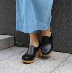 Leather clogs on a wooden sole. Made of smooth matte leather that adds elegance to a wooden sole. Thanks to the profiled side cut, each leg looks very neat. Perfect for minimalists who primarily value convenience and simplicity. Ideally suited to both day and evening stylizations. They will fit bare feet as well as tights or socks.We use only natural materials produced in the EU, leather comes from Italy and wood from Poland. Wooden sole is specially profiled, in such a way that you will be able Heeled Clogs, Gray Headband, Curated Closet, Swedish Clogs, Gray Accessories, Toddler Hairstyles Girl, Wooden Clogs, Med Student, Clog Heels