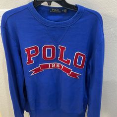 Royal Blue Polo 1967 Ribbon Sweatshirt. The Colors On This Shirt Are Excellent Condition. Looks Brand New. Blue Casual Top With Embroidered Logo, Casual Blue Tops With Embroidered Logo, Casual Blue Top With Embroidered Logo, Blue Crew Neck Sweatshirt With Embroidered Logo, Blue Long Sleeve Sweatshirt With Embroidered Logo, Blue Crew Neck Sweatshirt With Logo, Blue Sporty Sweater With Embroidered Logo, Blue Sporty Sweater With Logo Print, Sporty Blue Sweater With Logo Print