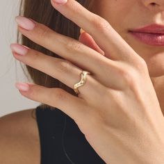 a close up of a person wearing a ring