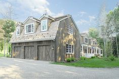 a large house with two garages in the front and one on the other side