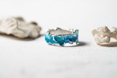 Beautiful ring Wave will bring you back to the sea! This ring is unique! Using hot enamel technique every item receives his own unique texture! https://www.etsy.com/listing/559371911/ - Wide wave ring (10 mm) Details: Width: 5mm Thickness: 1.2 mm Materials: sterling silver 925, hot vitreous enamel These rings in gold: https://www.etsy.com/listing/932462309/ - Gold blue wave https://www.etsy.com/listing/932465221/ - Gold green wave Please provide me size of the ring during the order, thank you! T Ocean-inspired Blue Ring For Gift, Ocean-inspired Blue Ring For Gifts, Ocean-inspired Promise Ring, Ocean-inspired Blue Rings As Gifts, Ocean-inspired Blue Jewelry For Anniversary, Blue Ocean-inspired Jewelry For Anniversary, Blue Enamel Rings For Anniversary, Unique Enamel Rings For Anniversary, Handmade Blue Stackable Rings For Wedding