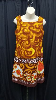 Vintage 1970's Made in Hawaii Bright Orange, Yellow, & Rust Cotton Sleeveless Shift Sun Dress w Island Map.  Dress features darts on the bust and a 4 button closure on the back.  Dress is in excellent condition - see pics! Measurements: bust 36, waist 33, shoulder to shoulder 13, neck opening 8 1/2, length 34 1/2, hem 1 1/2 inches. Map Dress, Style Année 60, 60s And 70s Fashion, Island Map, 60s Fashion, Sun Dress, 70s Fashion, Vintage 1970s, Dress Clothes For Women