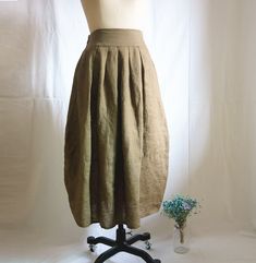 " *Elastic waist *Pleated skirt *two pockets at each side *Length approx: 80cm/31.5\" *Wash by hand or machine with cold water Auailable in women's us size XXS to 3XL as well as custom size and plus size  XXS: Waist:66cm/26\" Length:80cm/31.5\" XS: Waist:70cm/27.5\" Length:80cm/31.5\" S: Waist:74cm/29\" Length:80cm/31.5\" M: Waist:78cm/30.5\" Length:80cm/31.5\" L: Waist:82cm/32\" Length:80cm/31.5\" XL: Waist:86cm/33.8\" Length:80cm/31.5\" XXL: Waist:90cm/35.5\" Length:80cm/31.5\" 3XL: Waist:94cm Flowy Khaki Summer Skirt, Summer Khaki Flowy Skirt, Khaki Knee-length Summer Skirt, Khaki Midi Skirt For Summer, Khaki Skirt With Pockets For Summer, Summer Khaki Skirt With Pockets, Baggy Knee-length Summer Skirt, Summer Pleated Khaki Skirt, Fitted Linen Skirt With Gathered Detail