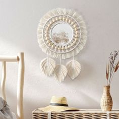 a wicker basket sitting on top of a wooden floor next to a white wall