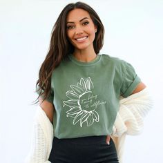 Looking for a cute versatile top to wear? Make sure to grab one of our Graphic tees! This soft and comfortable graphic tee is the perfect top for any outfit. It can be paired with biker shorts, jeans, or even a simple skirt/dress! This tee is true-to-size, so be sure to order your regular t-shirt size! If you are looking for a more oversized look, make sure to size up! Among The Wildflowers, Flower Shorts, Pregnancy Tshirts, Casual Fit, Contrast Stitch, Casual Fits, Tee Shop, Graphic Hoodies, Vintage Look