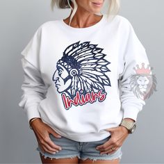 Show off in the stands with this Indians spirit wear mascot tees & sweaters. These shirts are great gifts for coaches, teachers, fans, sports players, moms, dads & the whole family! You can customize the design colors to reflect your favorite school, college, or team. To add a name (and or number) to the back of a shirt, add lounge pants, expedite processing, add overnight shipping, and any other miscellaneous items- please follow this link: https://www.etsy.com/shop/KASPDesign?ref=seller-platform-mcnav§ion_id=27547745 The listing is for one garment.  To order... 1. Select the style and size you would like, then the color for the garment.  2. Fill out the personalization section. 3. Then add to cart. To order more than one item of the same style, size, and color increase the quantity in yo Warriors Shirt Design, Pre-shrunk School Spirit Hoodie For Sports Season, Team-colored Sweatshirt With Team Logo For Fans, Team-colored Sweatshirt With Team Logo, Fleece Sweatshirt With Team Logo For Fan Merchandise, Team Logo Hoodie For Fan Merchandise, Varsity Fleece Top For Fan Gear, Sports Fan Gear Hoodie, Fleece Sweatshirt Fan Apparel