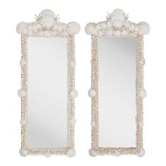 a pair of mirrors with shells on them