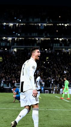 the soccer player is celebrating his team's victory over the opposing team on the field