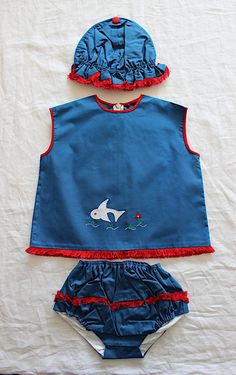 "VINTAGE 60's, stunning little summer set, top + bloomers + hat, petroleum blue poplin cotton canvas, red fringed edgings, \" fish appliqué and embroideries. Brand \" Kiba \", made in Belgium. Size 2 years Top : Length \" / Underarms \"  New old stock  I always refund overcharged shipping from 1 Euros overpaid ! Thank you for your visit" Beach Cotton Sets With Ruffles, Blue Cotton Ruffled Sets, Blue Cotton Ruffle Sets, Beach Embroidered Cotton Set, Summer Cotton Sets With Embroidered Hem, Embroidered Beach Sets For Spring, Blue Ruffled Summer Sets, Fitted Cotton Sets For Playtime, Fitted Cotton Sets With Ruffles