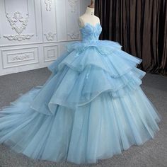 Step into a fairytale with this romantic princess quinceanera dress. This enchanting dress is made from delicate lace fabric in a dreamy sky blue color. The strapless neckline and sleeveless design create an elegant look, while the cathedral train adds a touch of grandeur to this dress. With the appliqued details and ruffled embellishments, this gown is perfect for making your quinceanera celebration unforgettable. Details: Silhouette: Ball Gown Style Fabric: Lace Fabric Color: Sky Blue Color Le Dreamy Sky, Sequin Ball Gown, Romantic Princess, Enchanting Dress, Cathedral Train, Sky Blue Color, Gown Style, Quinceanera Dress, Ball Gown Skirt