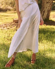 The Godet Skirt. takes cues from a 1930s gown, reimagined through our signature casual lens. The easy, pull-on skirt has an elasticated waistline with a top block that loosely flatters the hips while the godet insets add volume to the sweeping hemline. Style it back to The County Top. for a sweet and charming set. Chic Maxi Skirt With Elastic Waistband And Relaxed Fit, Chic Relaxed Fit Maxi Skirt With Elastic Waistband, Flowy Tiered Skirt With Gathered Waist, Spring Bottoms With Gathered Waist For Daywear, Spring Rayon Maxi Skirt With Gathered Details, Elegant Bottoms With Gathered Waist For Daywear, Daywear Flared Maxi Skirt With Elastic Waistband, Chic Maxi Skirt With Gathered Waist, Flowy Midi Skirt With Gathered Waist