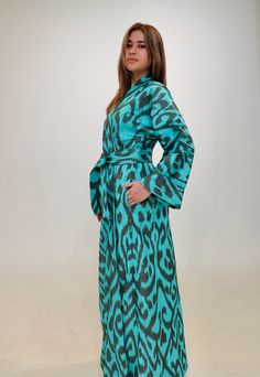 100% HANDWOVEN HAND DYED cotton ikat handwoven tiered kaftan made in UZBEKISTAN.   Indulge in the allure of our exquisite Uzbek Kimono from the limited edition luxury ikat fabrics collection for the season of 2024, brought to you by Bonu Collectives. Our commitment to handwork and ethical fashion shines through in this masterpiece, meticulously handwoven and dyed in Uzbekistan. This Uzbek Kimono is a work of art, featuring the intricate patterns of elegant ikat. The vintage charm and contemporary design make it a versatile addition to your collection. Whether paired with casual outfits or draped over a dress, this kimono is sure to make a statement and is known for its elaborate process in creating captivating designs. The Handwoven Kimono boasts a standard size that is adjustable for a pe Festive Traditional Ikat Print Kaftan, Luxury Ikat Print Festive Dresses, Luxury Blue Ikat Print Traditional Wear, Luxury Ikat Print Kaftan, Uzbek Ikat, Ikat Fabric, Perfect Gift For Her, Ethical Fashion, Fabric Collection