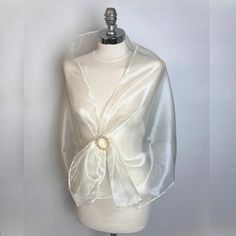 A very elegant organza shawl for your wedding party or evening dress. Made of light organza, slightly sparkles on the sun or light. Color: ivory or gold or blue green or black ( other colors are available ) Size : 150 cm x 48 cm approx   You can use it as a wrap, shawl or stola. WE have matching bags in our Etsy Shop! WE accept credit cards! Elegant Fitted Evening Veil, Elegant Sheer Dupatta For Wedding, Sheer Organza Party Veil, Sheer Organza Veil For Party, Elegant Fitted Veil, Elegant White Silk Scarf For Party, Elegant Fitted Shawl Dupatta, Sheer Wedding Dupatta, Formal Organza Shawl