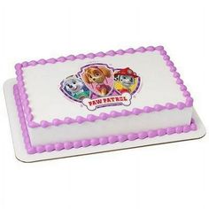 a birthday cake with paw patrol frosting on the top and pink trimmings