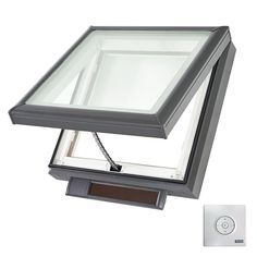 a square glass skylight mounted on the side of a wall with a remote control