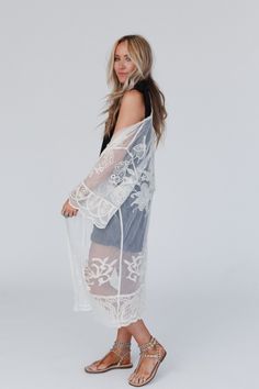 With its intricate design and comfortable fit, the Butterfly Beach Kimono is the perfect addition to any boho wardrobe! Whether you're dressing up or down, this kimono is the perfect finishing touch to any boho look because it features: See-through design crafted from delicate embroidered lace Flowy and lightweight, perfect for warm weather or layering Versatile front tie closure for a customizable fit and added style Intricate butterfly-inspired details for a charming and boho look Your favorit Bohemian Lace Beach Cover-up, Lace Open Front Cover-up For Summer, Summer Long Embroidered Cover-up, Long Embroidered Summer Cover-up, Bohemian Kimono With Floral Embroidery For Beach, Bohemian Sheer Cover-up For Summer, Long Lace Beachwear Cover-up, White Lace Cover-up For Spring, Bohemian Lace Patchwork Summer Cover-up