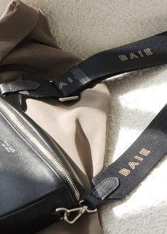 Let’s just say you’ll be looking for reasons to leave the house with the BAIE Strap. With its smooth Nappa leather details and edgy design, this long adjustable strap goes with just about everything, giving your everyday diaper bag a whole new look and feel. Edgy Design, Monogrammed Items, Changing Pad, Black Hardware, Nappa Leather, Black Friday Sale, Say You, Leather Trims, Black Silver