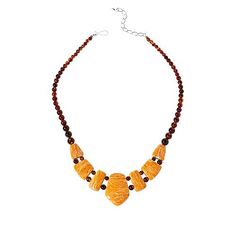 Jay King Brown Amber and Orange Spiny Oyster Shell Reversible Necklace You get two, fashionable looks in one with this unique, handcrafted brown amber and orange spiny oyster shell reversible necklace. Wear it as a solid amber piece or simply flip it over to add the fun, color contrast of orange spiny oyster shell.       Necklace approx. 18-1/4"L x 5/16"W with 2-3/4" extender     Center drop approx. 1-1/2"L x 1-1/8"W     Stamped .925      Hook closure     Brown amber necklace has drape with seve Artisan Orange Gemstone Necklace, Brown Baltic Amber Round Jewelry, Brown Baltic Amber Jewelry, Round Brown Baltic Amber Jewelry, Handmade Baltic Amber Necklace In Brown, Handmade Brown Baltic Amber Necklace, Brown Pendant Jewelry With Lobster Clasp, Brown Round Necklace With Lobster Clasp, Orange Baltic Amber Pendant Necklace