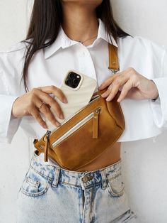 This leather hip bag is perfect for traveling or just to carry in your everyday bag. The personalized fanny pack will help you to keep all necessary staff like phone, wallet, cards, face mask in one place during the day. You can wear it as a belt bag or like a fanny pack or crossbody bag - it's up to your mood :) Great idea for birthday gift or Mother's day gift ! Bag can be personalized monogram. The Funny backpack is made from one piece quality Crazy Horse. When you hold it in your hands, you Bum Bag Outfit, Trendy Belts, Bag With Pockets, Leather Hip Bag, Leather Waist Bag, Minimalist Bag, Hip Belt, Spring Accessories, Leather Fanny Pack