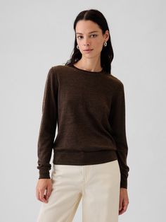 Soft wool sweater.  Crewneck.  Long sleeves.  Responsible Wool Standard certified.  Fit: Classic.  A straight & easy fit.  Hits at the hip.  Models wearing Gap Quality Wool Sweaters, Classic Womens Sweater, Cozy Workwear Sweater At Affordable Price, Black Merino Sweater, Brown Sweater Outfit, Soft Wool Sweater, Merino Wool Clothing, Winter Sweater Outfits, Clear Spring