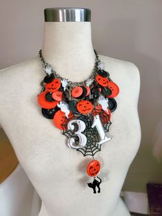 "Halloween Statement Necklace - One of a Kind - Vintage Black & Orange Buttons, Skeleton Keys, Ghost, Cat and Pumpkins, Spider Webs and Vintage Silver Metal \"31\" numbers - Only from Key of A Upcycled Jewelry~ This statement piece will be the envy of all your spooky friends this Halloween!  If you are not partaking in any costume parties, but you are going on a night out where you will be dressing up, why not accessorize your look with this one of a kind Halloween themed statement necklace!?  W Halloween Themed Black Necklace, Black Themed Necklace For Halloween, Themed Black Necklace For Halloween, Novelty Halloween Party Necklaces, Vintage House Numbers, Pumpkin Beads, Pumpkin Bead, Skeleton Keys, Costume Parties