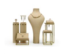 an assortment of jewelry is displayed on a white background, including a vase and stools