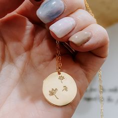 Adorable dandelion necklace features three dandelions hand stamped on the 19mm coin with a dainty chain. Smooth edges or hammered edges, you pick! Available in 14k gold fill or Sterling Silver. 18" or 20" inch length. If you would like to request a different length, please leave a note below. Classic Pearl Earrings, Dandelion Necklace, Shield Ring, Dainty Chain, Electronic Gifts, Hammered Gold, Smooth Edges, Coin Necklace, Hammered Silver