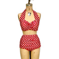 Go ahead and make a splash in the Helen bikini, a cute 1950s custom made vintage style bathing suit. The Helen bikini top has a pinched front with halter straps that tie behind the neck. It is totally lined and comes with removable beefy bra cups. The Helen briefs are high waisted and fully lined. The side has ruching for a nice flattering effect. The briefs are basic and simple with a classic low leg cut but have an extra front panel that is gathered at the sides to give the briefs a very perio Cheap Retro Swimwear For Pool, Cheap Retro Pink Swimwear, Cute Bathing Suits Modest 50s, Cheap Retro Multicolor Swimwear, Vintage Swimwear Preppy, Vintage Bathing Suits 1950s Retro Swim, 80s Swimsuit Bikinis, Polka Dot Fitted Tankini For Poolside, Poolside Fitted Polka Dot Tankini