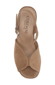 Pamper your feet in this Italian-made suede-wrapped sandal featuring a cushioned footbed and rocker platform for comfortable strides. A logo-bedecked tread pattern gives a signature finish for added style points. 3 1/4" heel Adjustable ankle strap with buckle closure Cushioned footbed Leather upper and lining/rubber sole Made in Italy Suede Open Heel Wedge Sandals, Platform Suede Closed Toe Wedge Sandals, Suede Closed Toe Platform Wedge Sandals, Closed Toe Suede Platform Wedge Sandals, Suede Heels With Cushioned Footbed And Wedge Heel, Suede Closed Toe Wedge Sandals With Removable Insole, Suede Wedge Sandals With Removable Insole And Open Heel, Suede Sandals With Cushioned Footbed And Ankle Strap, Suede Closed Toe Sandals With Branded Insole