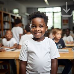 a young boy smiles while standing in front of desks with other children behind him