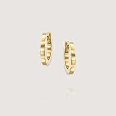 Our simple yet elegant iconic hoop earrings. Timeless and Classic, fits any outfit and any occasion. Made of 14K gold, open and close with a strong safe mechanism , simple and comfortable. Perfect for the everyday casual chic look, they can also be worn to top off an exquisite evening look. The earrings are sold as singles All of our jewelry is carefully handmade in our atelier To order by phone 972-72-2991000 Minimalist Polished Finish Hoop Earrings For Everyday Luxury, Small Hoop Minimalist Earrings For Everyday Luxury, Minimalist Small Hoop Earrings For Everyday Luxury, Modern 14k Gold Hoop Earrings For Everyday Elegance, Modern Yellow Gold Huggie Earrings For Everyday, Modern Hoop Earrings For Everyday Elegance, Modern Single Hoop Earring For Everyday Elegance, Modern Luxury Huggie Earrings, Modern Single 14k Gold Hoop Earring