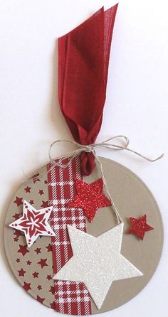 an ornament with red and white stars on it