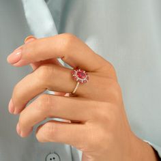 Celebrate your femininity with this gorgeous Ruby Floral Ring. This beautiful flower ring portrays elegance and charm. Made of 14k solid gold. Elegant Ruby Ring For Proposal, Fine Jewelry Yellow Gold Ruby Ring With Halo Design, Flower Shaped Ruby Gemstone Rings, Elegant Ruby Ring With Prong Setting For Proposal, Elegant Pink Cubic Zirconia Flower Ring, Yellow Gold Ruby Ring For Proposal, Yellow Gold Ruby Halo Ring For Promise, Elegant Flower Ruby Ring For Formal Occasions, Elegant Yellow Gold Ruby Ring For Proposal