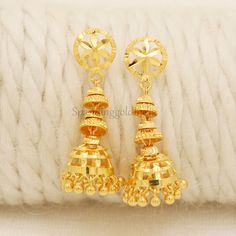 Celebrate the essence of Indian heritage with these radiant 22k gold earrings. Each earring is meticulously designed with traditional patterns that catch the light and add a regal touch to your look. Perfect for both festive occasions and elegant evenings, these earrings are a testament to the rich history of Indian jewelry, offering a blend of classic beauty and modern sophistication. 22k gold earrings handmade jewelry made in India Metal is Real Gold Not Filled or Not Gold Plated Metal - Yello Festive 22k Yellow Gold Bridal Earrings, Yellow Gold Meenakari Jhumkas For Diwali, Yellow Gold Jhumkas For Wedding And Festivals, Navratri Yellow Gold 22k Jhumkas, Festive Yellow Gold Jhumkas For Diwali, Temple Jewelry Style Yellow Gold Jhumkas For Celebration, Yellow Gold Jhumkas For Navratri Gift, Temple Jewelry Yellow Gold Jhumkas For Celebration, Yellow Gold Temple Jewelry Jhumkas For Celebration