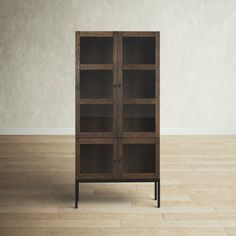 an empty room with a bookcase on the floor