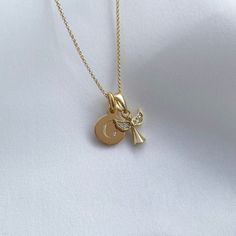 This stunning angel necklace will be her guardian and watch over her as she grows.  Our yellow gold vermeil & CZ Angel necklace makes the perfect gift for special occasions such as Christenings, Naming Ceremonies or a First Holy Communion. This beautiful angel charm measures 1x1cm, moving freely on a dainty 16″ belcher chain with a lobster clasp fastening at the back. Our yellow gold vermeil mini disc charm measures 8x8mm, perfectly sized for initials.  Our yellow gold vermeil jewellery is made Angelic Gold Necklaces As Gifts, Angelic Gold Necklaces For Gifts, Angelic Gold Necklace For Gift, Angelic Gold Pendant Jewelry, Angelic Gold Pendant Necklace, Silver Quotes, Angel Charm, Belcher Chain, Angel Necklace