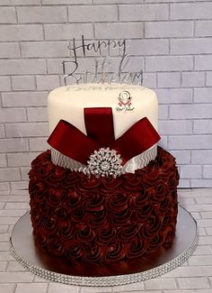 a red and white birthday cake on a plate