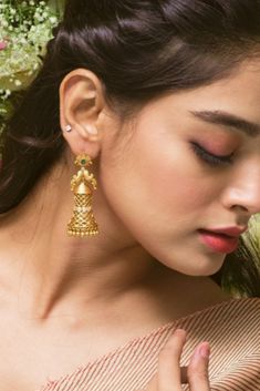 That's what everyone will say when they see you enter in our Lalita antique earrings. They're crafted in intertwined strands of soft antique gold plated metal surrounding cubic zirconia stones with peacock motifs.  We think there's only one word to describe them-stunning and you'll think so too! Peacock Motifs, Gold Earrings Indian, Dazzling Earrings, Jhumki Earrings, Jhumka Earrings, Latest Jewellery, Antique Earrings, One Word, Indian Jewellery