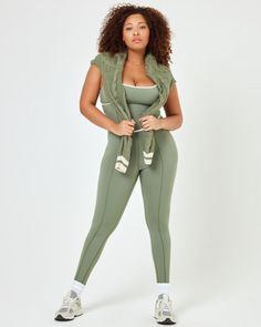 Getting dressed has never been easier than slipping into the Ace jumpsuit. This one-piece features dainty details like princess seams and a criss-cross back cut-out, while also being a performance piece that can get you through any workout. A shelf bra and removable pads keep your girls happy, too. Wear it with the coordinating Hamptons Sweater for a perfectly polished look. Impact level: Medium Activity type: Pilates, Yoga, Walking Jumpsuit Princess seams Adjustable straps Criss cross cutout at Compressive Sleeveless Jumpsuit With Built-in Bra, Green Sleeveless Jumpsuits And Rompers For Yoga, Sleeveless Jumpsuits And Rompers With Built-in Bra, Sleeveless Compressive Jumpsuit With Built-in Bra, Green Sleeveless Jumpsuits And Rompers In Athleisure Style, Green Sleeveless Athleisure Jumpsuits And Rompers, Green Sleeveless Athleisure Jumpsuit/romper, Green Sleeveless Athleisure Jumpsuit, Sleeveless Compressive Unitard For Loungewear