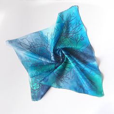 Square Silk Scarf with Navy Blue Tree Silhouette Pattern on a Grayish Blue-Turquoise Background This exquisite silk pocket square is ready to be shipped to you! Size:  55 by 55 centimeters (23" by 23") 88 by 88 centimeters (34" by 34") Silk: Pure Habotai Light - semi-transparent and subtly glossy. This foulard has been personally hand-painted by me directly onto silk! The intricate design won't fade or wash off, and it's visible on both sides of the scarf. Care Instructions: Please hand wash onl Artistic Hand Dyed Blue Silk Scarf, Artistic Blue Silk Scarves, Artistic Handmade Blue Silk Scarf, Blue Bohemian Hand-dyed Silk Scarf, Blue Bohemian Hand Dyed Silk Scarf, Artistic Blue Silk Scarf, Bohemian Blue Silk Scarf Gift, Bohemian Blue Silk Scarf For Gift, Bohemian Blue Silk Scarf As Gift