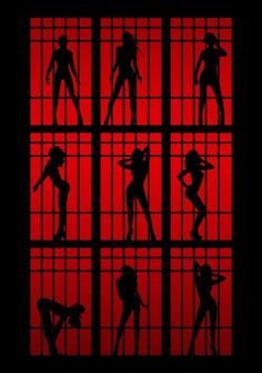 the silhouettes of people behind bars in jail cell doors with red light shining through them