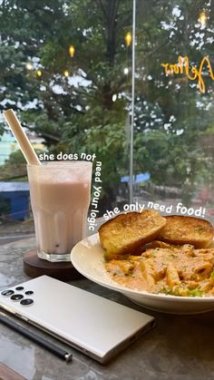 there is a plate of food and a drink on the table