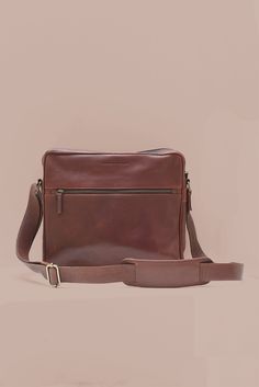 Carry your laptop in style & protection with our Leather Laptop Satchel in gorgeous brown leather. This sleek & durable satchel is specifically designed to fit a 13" laptop, ensuring your device stays safe while on the go. Lined in cotton with a YKK antique brass zipper closure Stay organized with two exterior pockets - one slip pocket with a magnetic closure on one side & a zippered pocket on the other to keep everything securely in easy reach Interior laptop divider & leather slip pocket Dimen Leather Briefcase With Laptop Sleeve For On-the-go, Classic Brown Shoulder Bag For On-the-go, Classic Laptop Bag With Sleeve For On-the-go, Casual Brown Rectangular Laptop Bag, Brown Business Bag With Laptop Sleeve, On-the-go Satchel Laptop Bag With Sleeve, On-the-go Laptop Bag With Sleeve, Satchel Style, On-the-go Laptop Satchel With Sleeve, Casual Business Satchel With Soft Leather