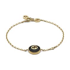 From Gucci, the Interlocking G logo appears in elegant new interpretations for Pre-Fall 2024. Precious black onyx stone is paired with yellow 18k gold and embellished with a sparkling diamond. This chain bracelet can be matched with other accessories from the same line. 18k yellow gold and black onyx stone Chain with Interlocking G detail Interlocking G charm 0.5" 1 white diamond, approximately 0.008 carats Clasp closure with Interlocking G Gucci Style #: YBA786556001017 Luxury Modern Gucci Bracelets, Gucci Luxury Adjustable Bracelets, Adjustable Gucci Bracelets For Formal Occasions, Luxury Adjustable Gucci Bracelets, Luxury Adjustable Gucci Bracelet, Gucci Formal Bracelet With Polished Finish, Formal Gucci Bracelet With Polished Finish, Gucci Bracelets With Polished Finish For Formal Occasions, Gucci Polished Finish Formal Bracelet