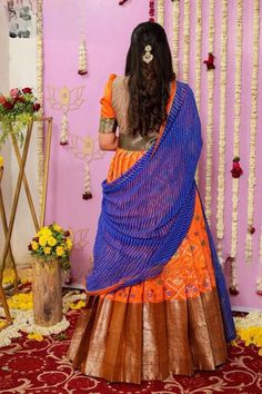 Festival Special Orange Color Pattu Gown with Blue Laheriya Style Dupatta Description: This magnetizing gown is prettified with beautiful weaving work, making it an elegant choice for any festival. The gown is made of pure silk fabric, accompanied by a crepe lining and a zari border. The neck is adorned with royal York work, adding a regal touch to your attire. Pair it with fancy accessories to enhance your look even more. Details: Color: Orange Dupatta: Blue Laheriya Style Fabric: Pure Silk wit Maxi Length Gown With Pallu For Traditional Ceremonies, Maxi Length Dupatta With Pallu For Traditional Ceremonies, Art Silk Gown With Self Design For Reception, Reception Gown With Self Design In Art Silk, Maxi Length Dupatta For Traditional Ceremonies, Traditional Maxi-length Dupatta For Ceremonies, Traditional Blue Gown With Pallu, Traditional Blue Gown For Festivals, Traditional Orange Gown For Eid