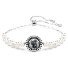 With its elegant blend of materials, this exquisite bracelet is one that you’ll always cherish. The rhodium-plated design features the iconic Swarovski swan motif, which is crafted from gray crystals and set on a central white Crystal Pearl surrounded by clear crystals. Around the wrist, the delicate chain is completed by a sliding ball mechanism and a set of Crystal Pearls on either side. The most graceful and sophisticated way to celebrate your love for Swarovski. Swarovski Swan Bracelet, Swan Bracelet, Duchess Swan, Clothes Pieces, Wishlist Board, Gray Crystals, Jordan Baker, Swarovski Swan, Random Fashion