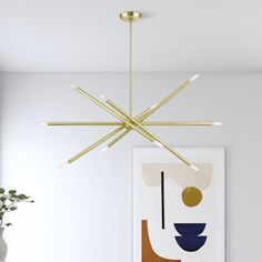 a modern chandelier hangs over a dining room table