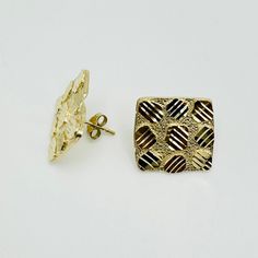 Check out our fresh new Square Nugget Earrings in solid 10k gold. Available in 3 sizes and featuring push backings, our new square nuggets give you that classic nugget finish but with a little twist that will set you apart from the rest. Available in 3 different sizes. Be sure to view the images for size references. Approximate sizes: Small (7-8mm) Medium (11-13mm) Large (14-15mm) Gold Diamond-shaped Earrings For Anniversary, Elegant Gold Nugget Earrings, Gold Hammered Rectangular Jewelry, Hammered Gold Rectangular Jewelry, Gold Nugget Earrings As Gift, Gold Rectangular Sterling Silver Earrings, Gold-toned Sterling Silver Rectangular Earrings, Gold Diamond-shaped 14k Earrings, Gold Hammered Square Pendant Jewelry